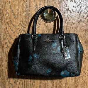 COPY - Canvas Coach purse with blue flowers.